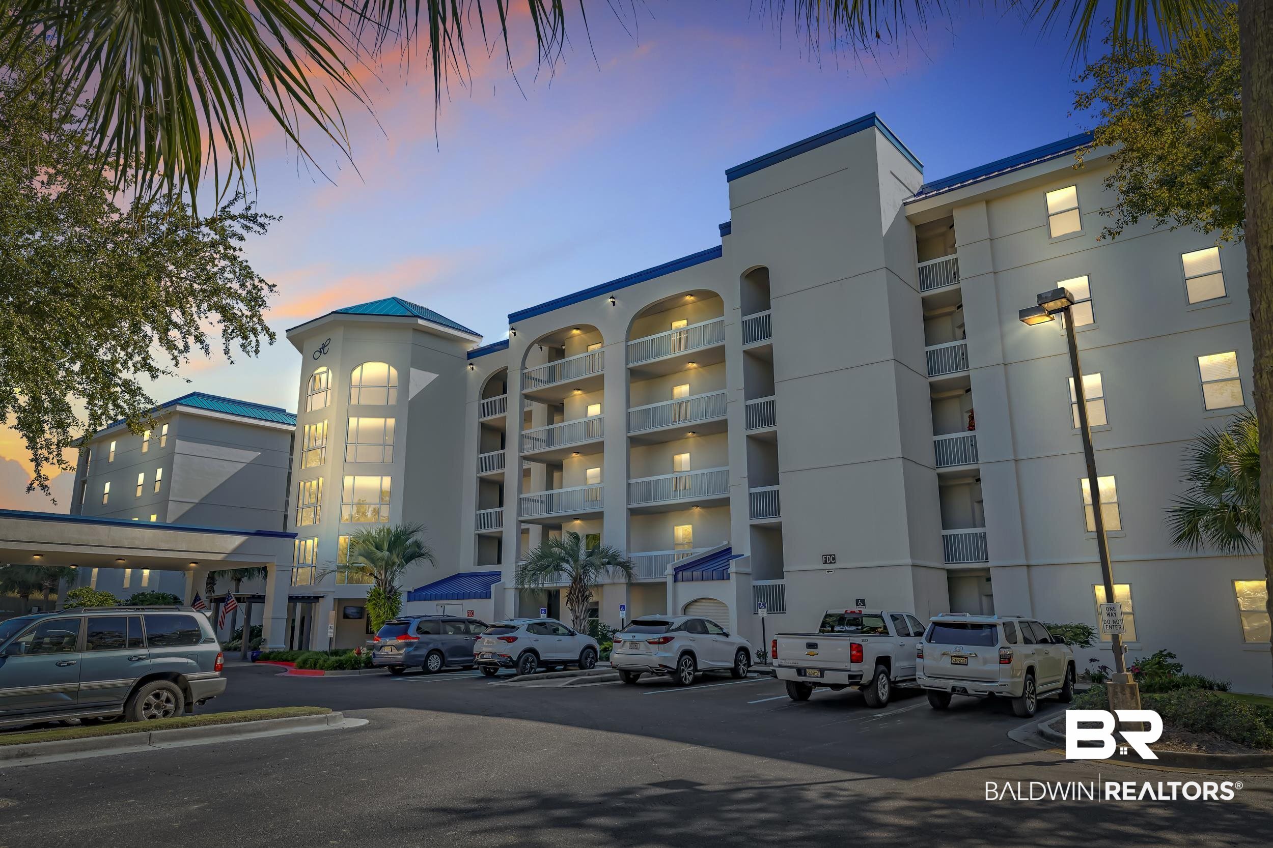 27282 Canal Road, Unit 104 Orange Beach, AL 36561 - Photo 76 of 79 View of apartment building / complex featuring uncovered parking
