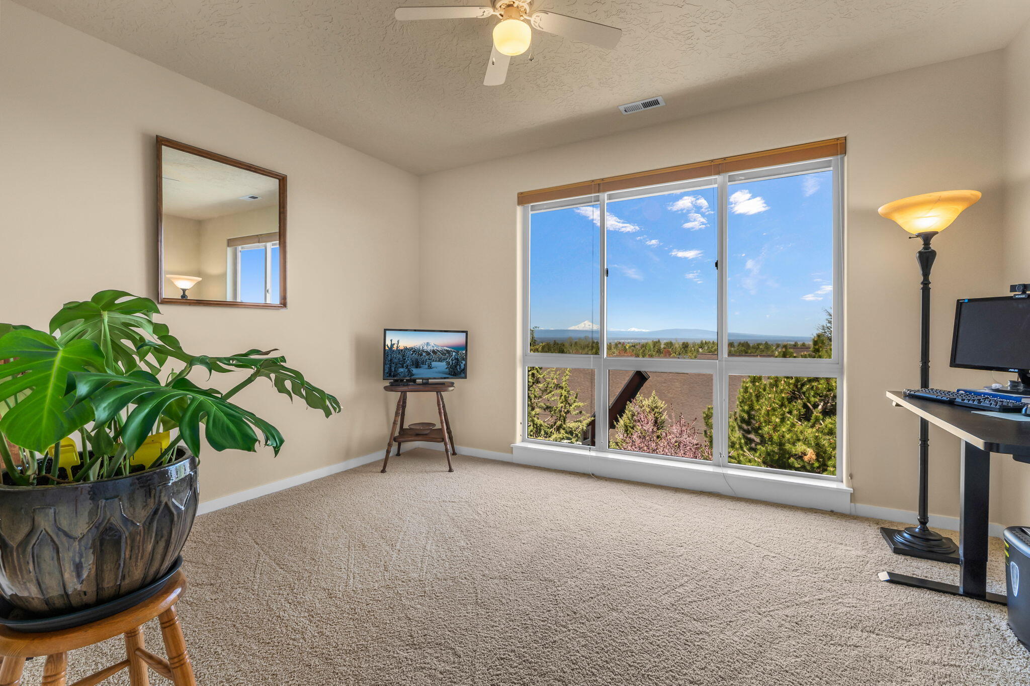 10870 Village Loop Redmond, OR 97756 - Photo 17 of 35 a view of a floor to ceiling window and a potted plant