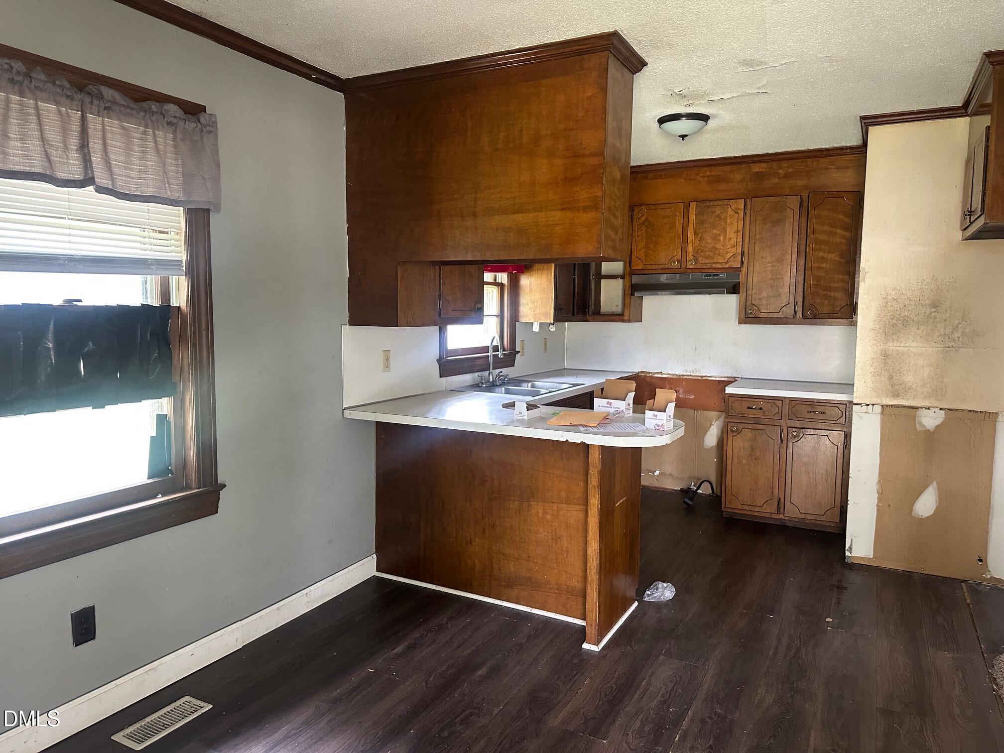 209 Greenacres Road Snow Hill, NC 28580 - Photo 3 of 15 a kitchen with stainless steel appliances granite countertop a stove a sink and a refrigerator