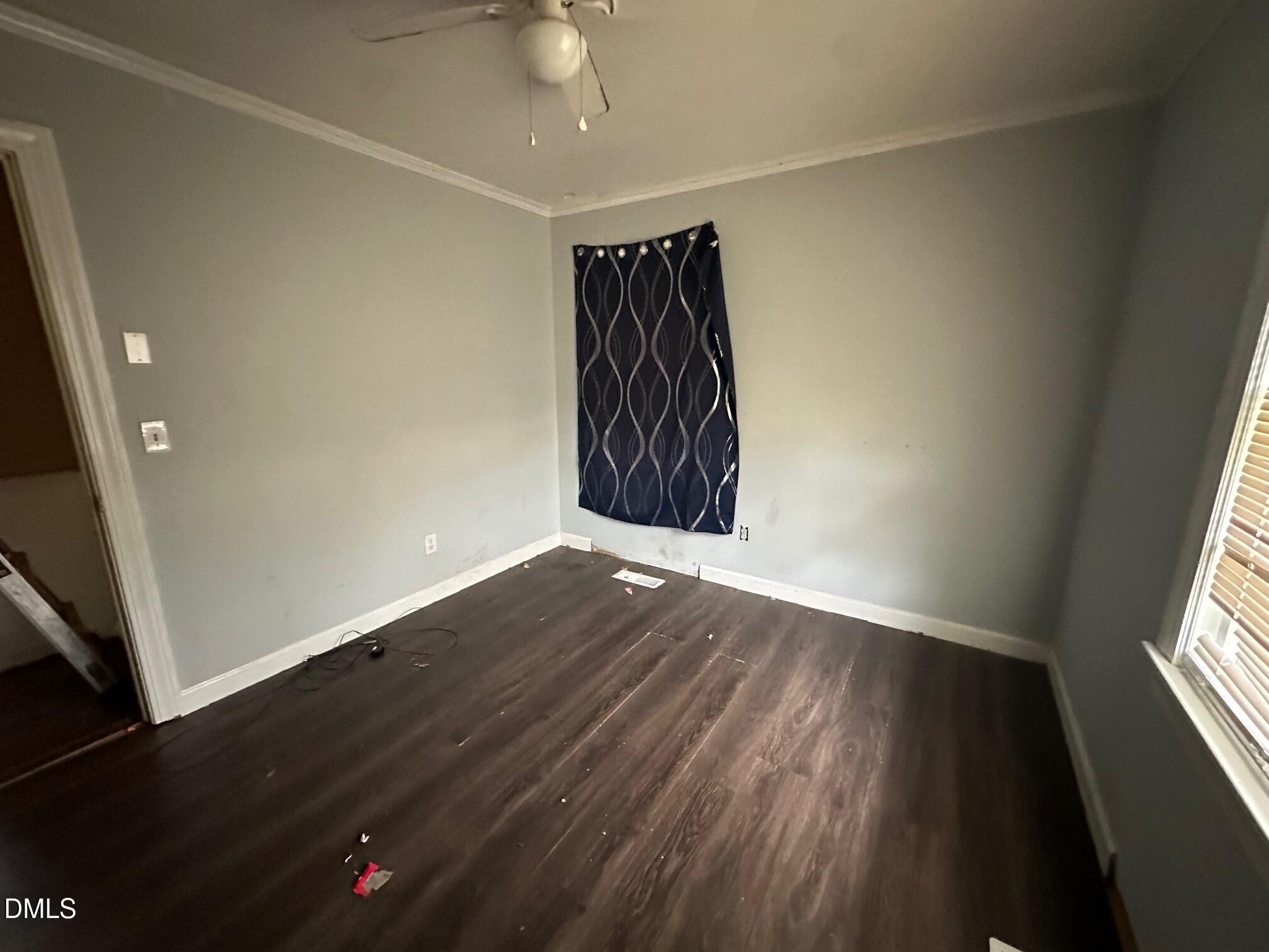 209 Greenacres Road Snow Hill, NC 28580 - Photo 9 of 15 an empty room with wooden floor and windows