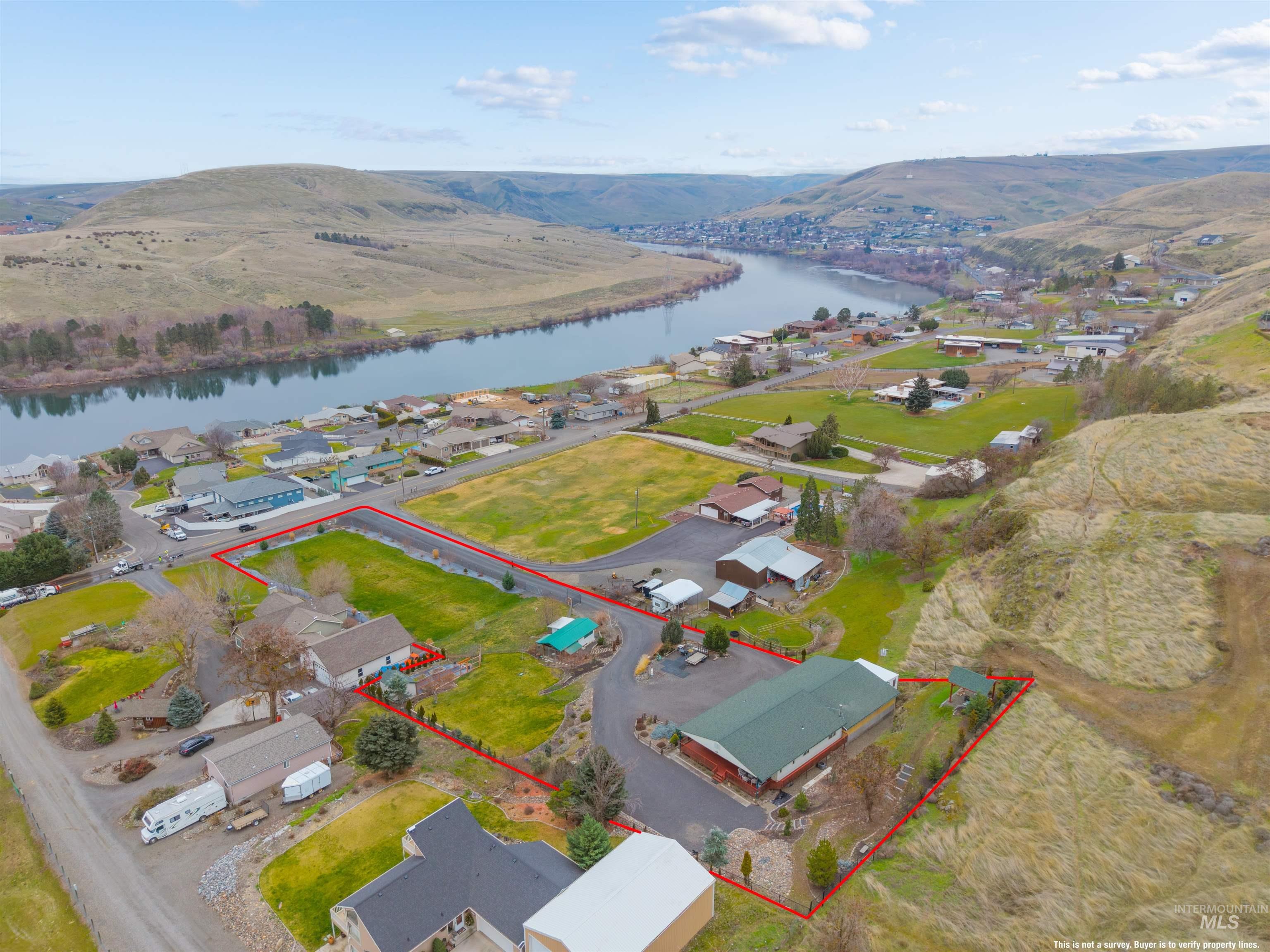 3350 Clemans Road Clarkston, WA 99403 - Photo 47 of 50 Aerial view of residential area with a large body of water and property boundaries highlighted