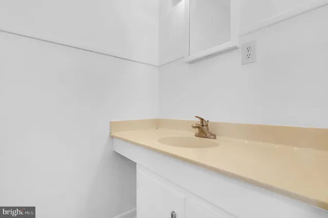 a bathroom with a sink and vanity