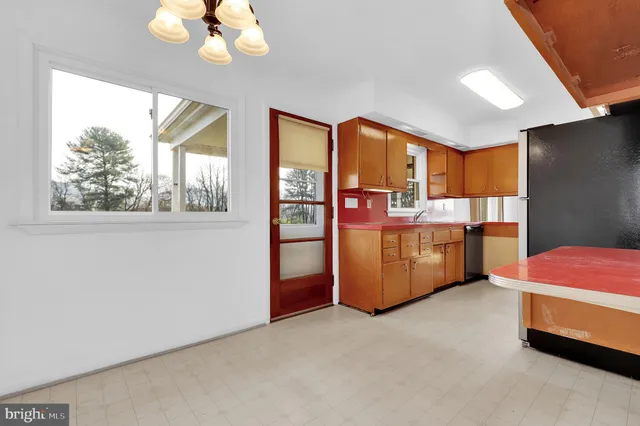 a bed room with a bed and window