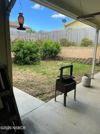 a view of a patio with table and chairs potted plants with wooden floor
