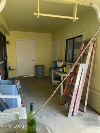 a room with stairs and furniture