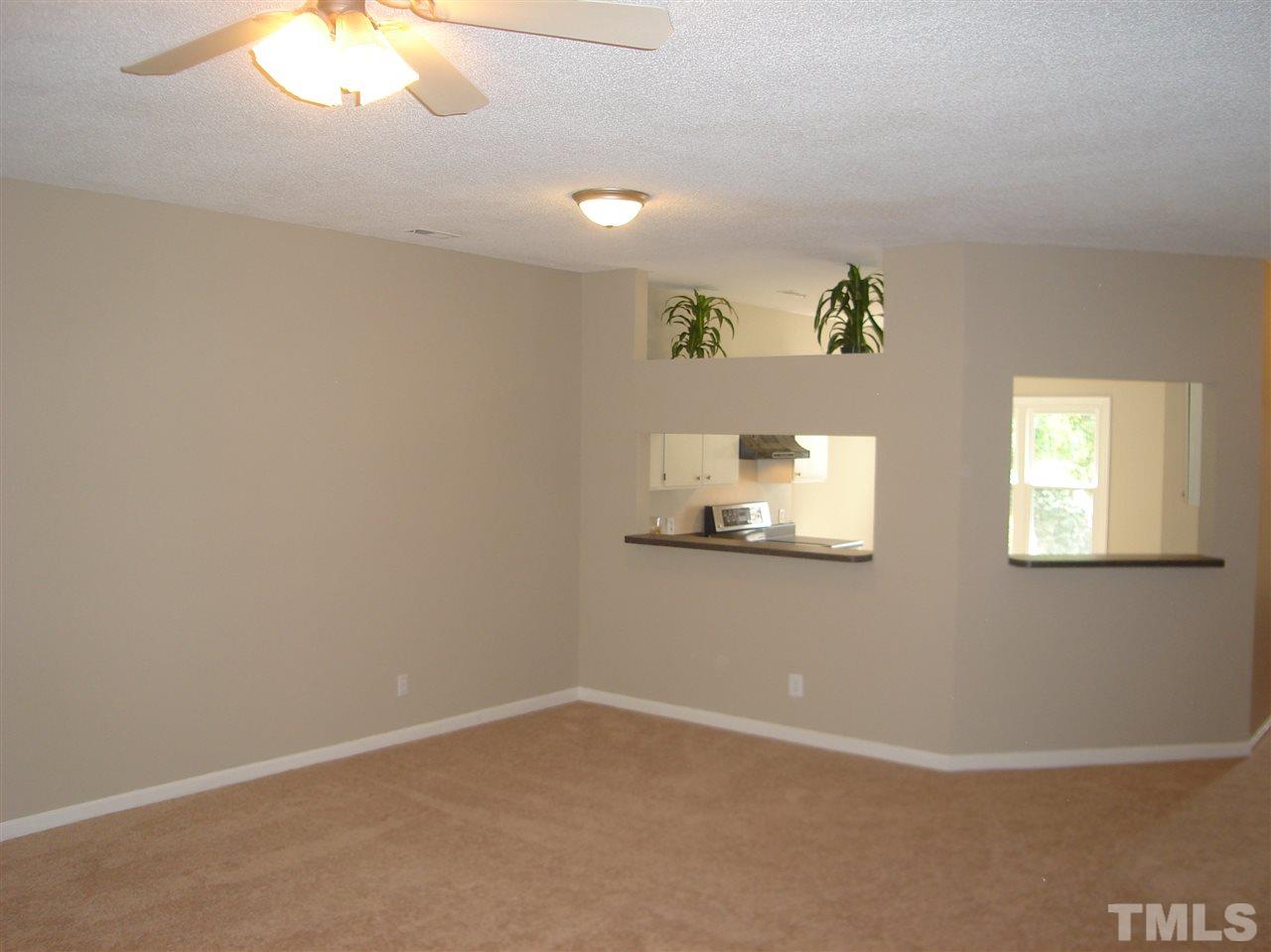 6151 Summer Pointe Place, Unit 202 Raleigh, NC 27606 - Photo 7 of 21 a view of an empty room