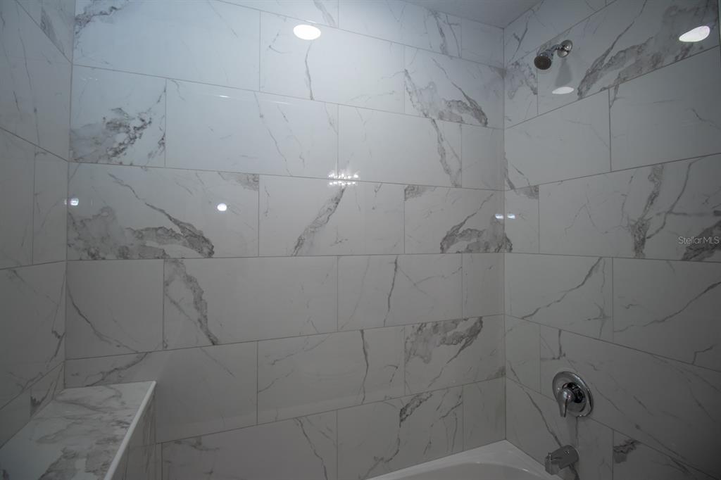 5422 Charles Street New Port Richey, FL 34652 - Photo 17 of 30 a bathroom with shower