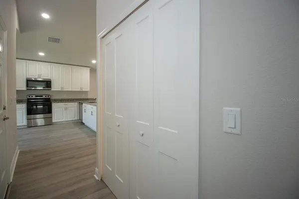 a view of kitchen with wooden floor