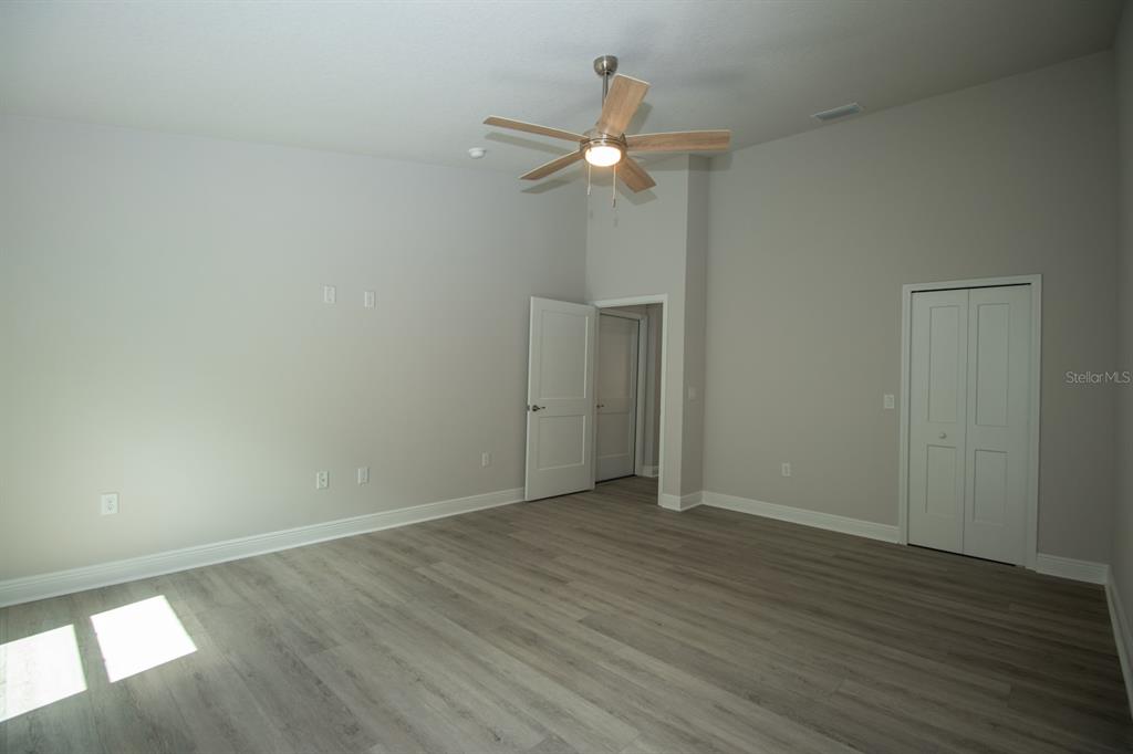 5422 Charles Street New Port Richey, FL 34652 - Photo 23 of 30 a view of an empty room with wooden floor