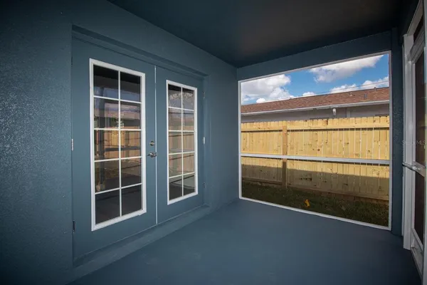 a view of an empty room with a window
