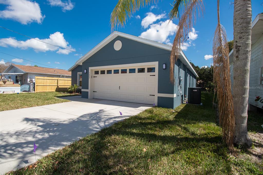 5422 Charles Street New Port Richey, FL 34652 - Photo 30 of 30 a house view with a garden space