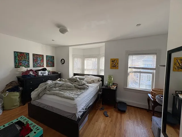 a bed room with bed and window