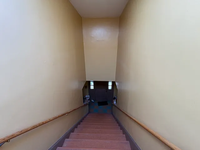 a view of hallway with wooden floor