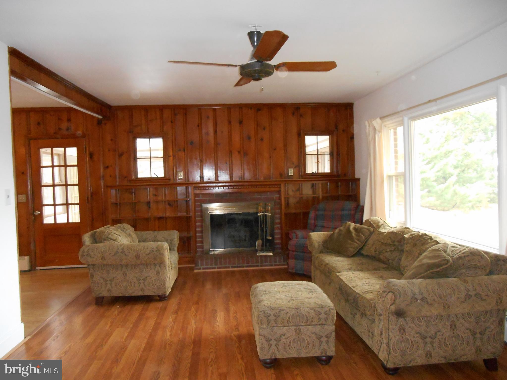 10015 New Bridge Road Denton, MD 21629 - Photo 13 of 30 Living Room (door to left leads to sunroom)