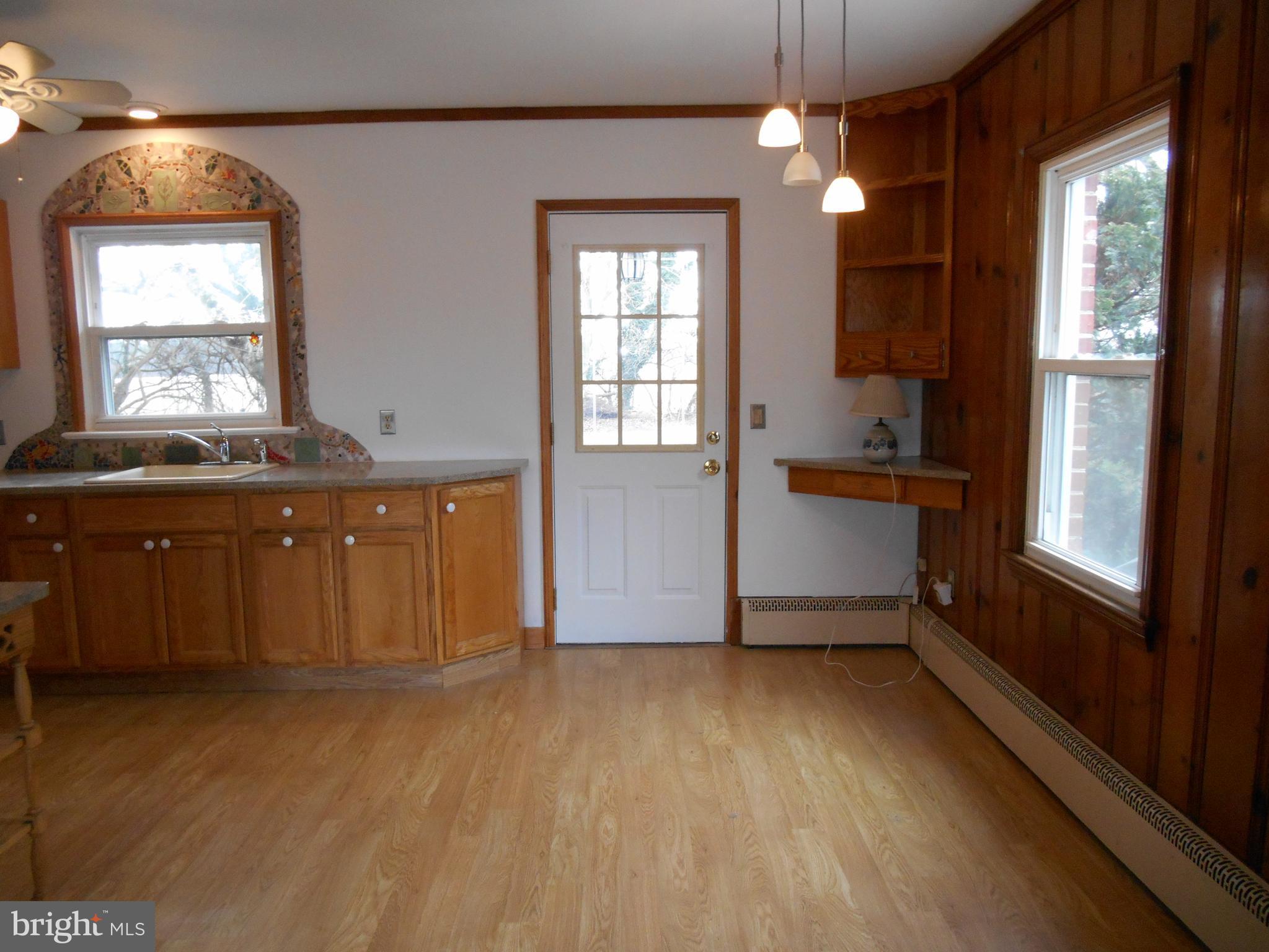 10015 New Bridge Road Denton, MD 21629 - Photo 10 of 30 View of kitchen from living room (door to outside)