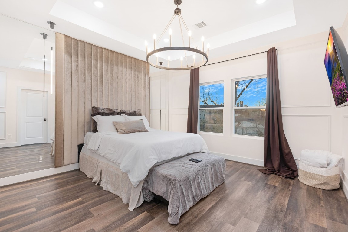 907 Pollard Street, Unit B Houston, TX 77020 - Photo 16 of 30 a bedroom with a bed mirror and window
