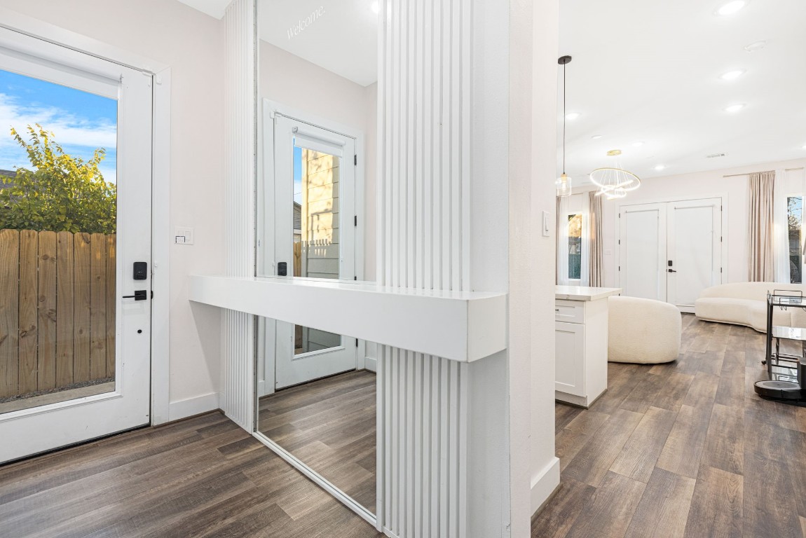 907 Pollard Street, Unit B Houston, TX 77020 - Photo 4 of 30 a view of a living room and hardwood floor