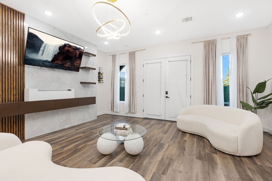 907 Pollard Street, Unit B Houston, TX 77020 - Photo 8 of 30 a living room with furniture and a flat screen tv
