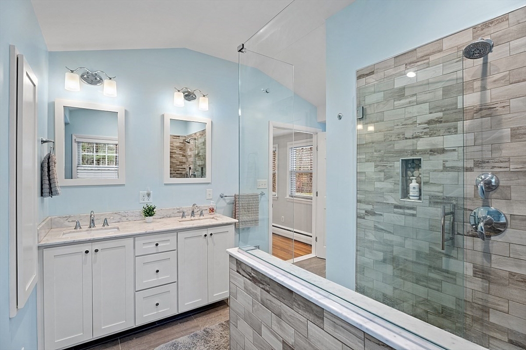 66 Old Right Road Ipswich, MA 01938 - Photo 21 of 36 a bathroom with a double vanity sink a mirror and a shower
