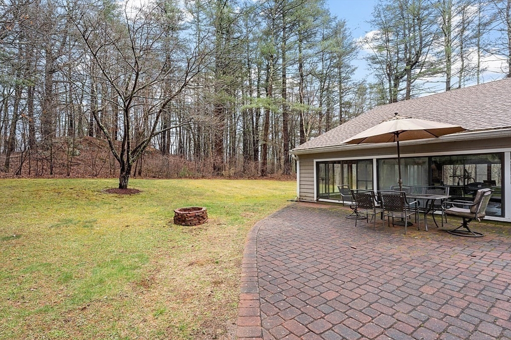 66 Old Right Road Ipswich, MA 01938 - Photo 32 of 36 a view of a house with backyard and sitting area
