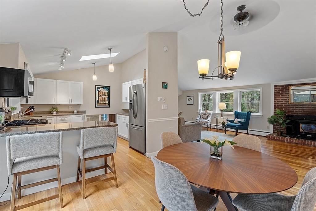 66 Old Right Road Ipswich, MA 01938 - Photo 8 of 36 a large kitchen with a table and chairs