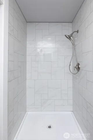 a bathroom with a shower and a bathtub