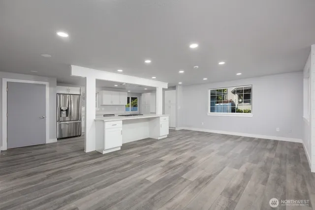 a view of kitchen with wooden floor