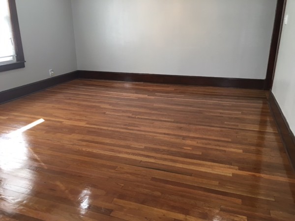 78 Fresno Street Springfield, MA 01104 - Photo 15 of 17 a view of an empty room with wooden floor and a window