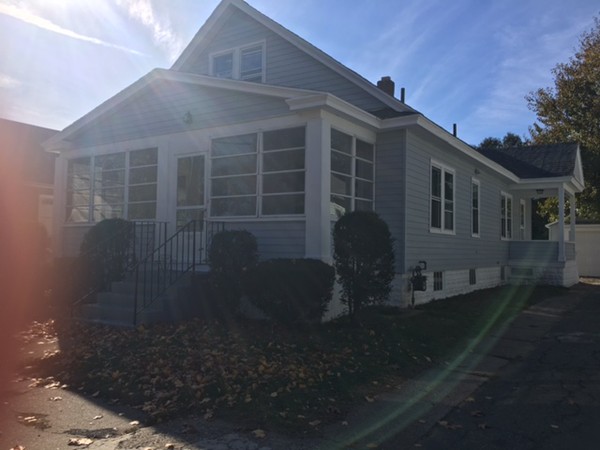 78 Fresno Street Springfield, MA 01104 - Photo 2 of 17 a front view of a house with garden