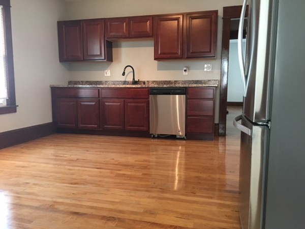 78 Fresno Street Springfield, MA 01104 - Photo 3 of 17 a kitchen with stainless steel appliances granite countertop a sink refrigerator and cabinets