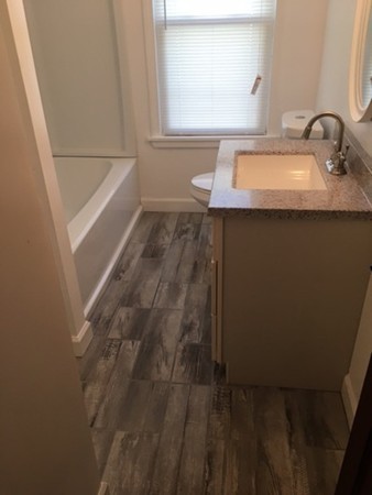78 Fresno Street Springfield, MA 01104 - Photo 6 of 17 a bathroom with a sink and a mirror