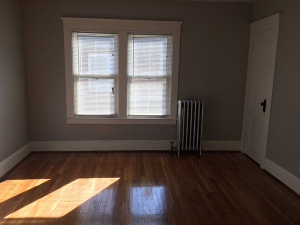 78 Fresno Street Springfield, MA 01104 - Photo 10 of 17 an empty room with wooden floor and windows