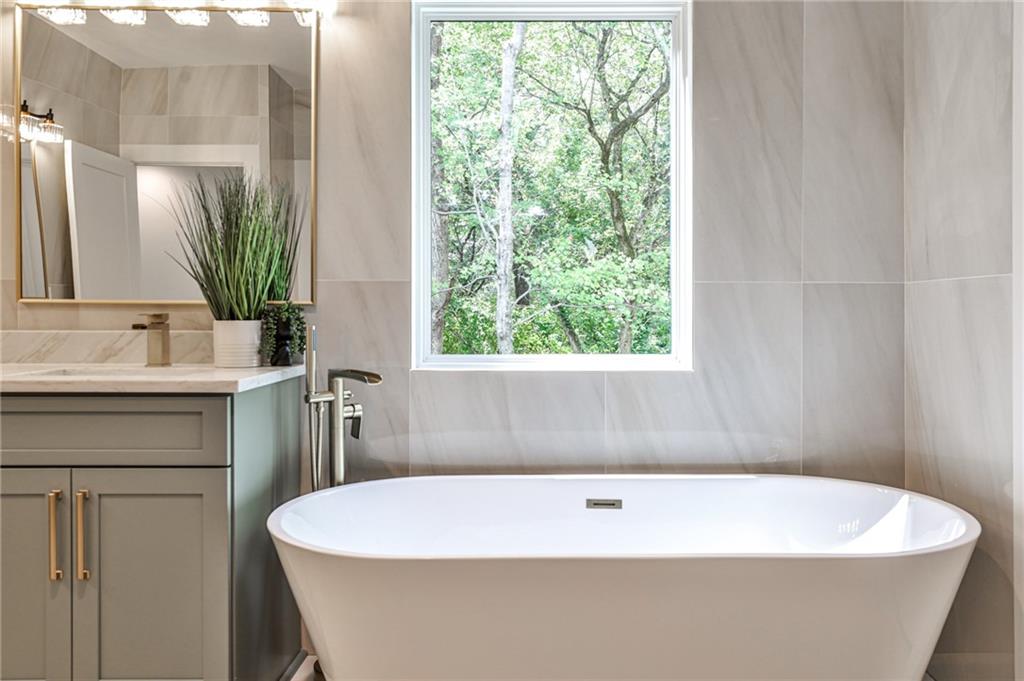 1401 Rupert Road Decatur, GA 30030 - Photo 21 of 43 a white bath tub sitting in a bathroom