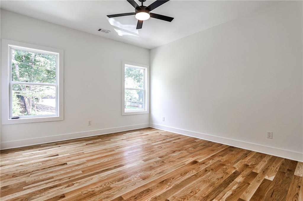 1401 Rupert Road Decatur, GA 30030 - Photo 24 of 43 a view of an empty room with wooden floor and a window