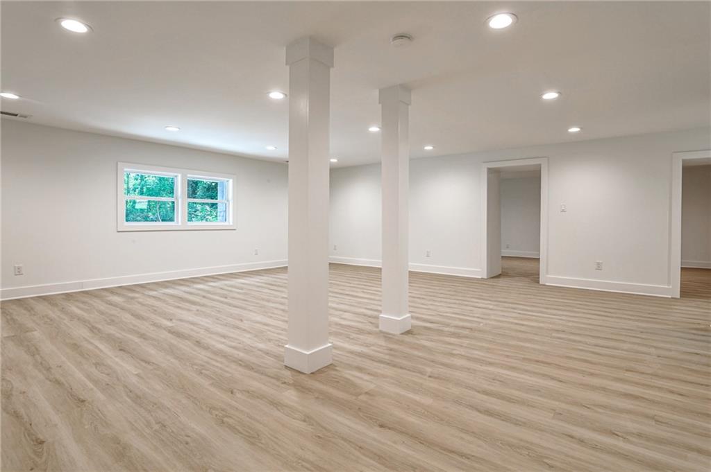 1401 Rupert Road Decatur, GA 30030 - Photo 34 of 43 an empty room with wooden floor and windows