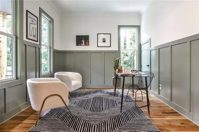 a view of a dining room with furniture and window