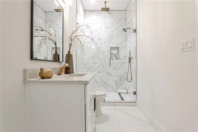 a bathroom with a bathtub sink and mirror