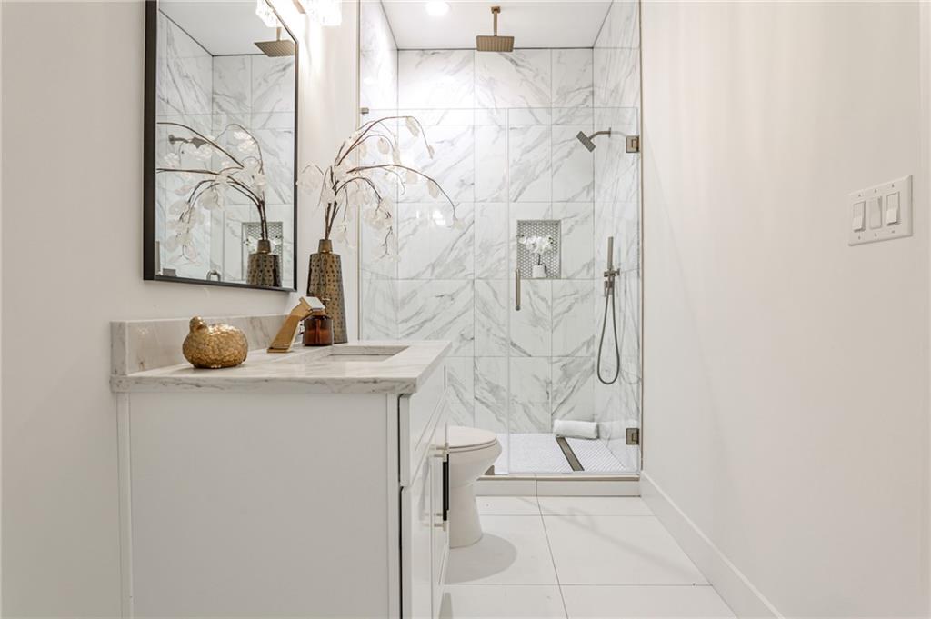 1401 Rupert Road Decatur, GA 30030 - Photo 7 of 43 a bathroom with a bathtub sink and mirror