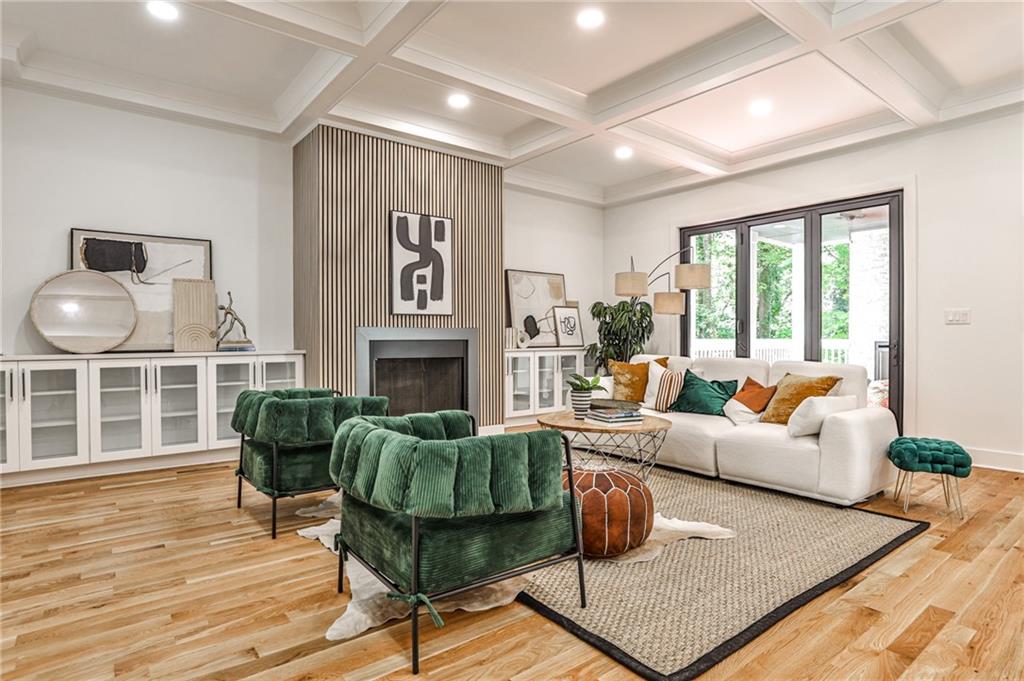 1401 Rupert Road Decatur, GA 30030 - Photo 8 of 43 a living room with furniture a fireplace and a large window