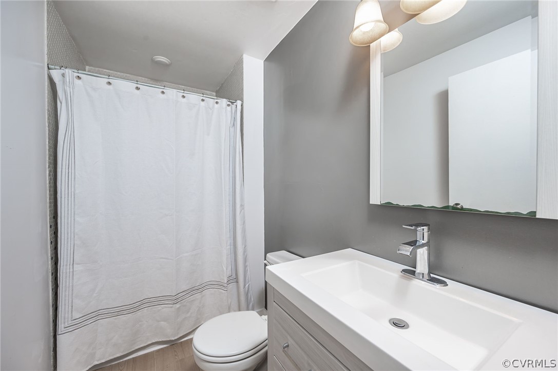 10523 White Rabbit Road North Chesterfield, VA 23235 - Photo 13 of 23 a bathroom with a sink toilet and shower