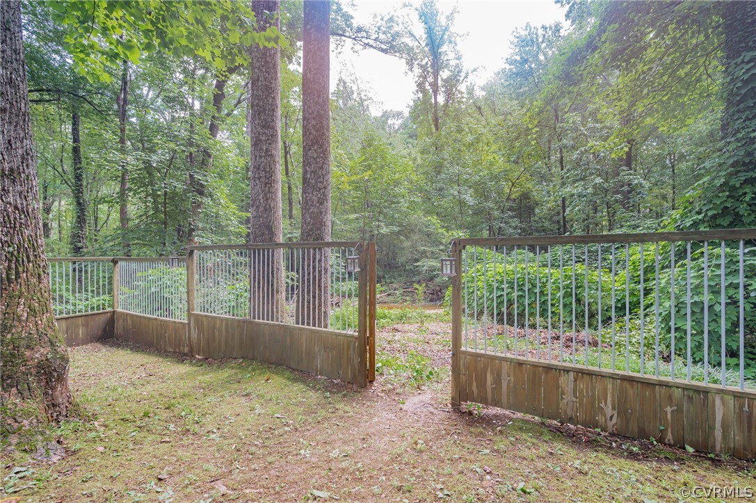 10523 White Rabbit Road North Chesterfield, VA 23235 - Photo 19 of 23 a backyard of a house with lots of green space