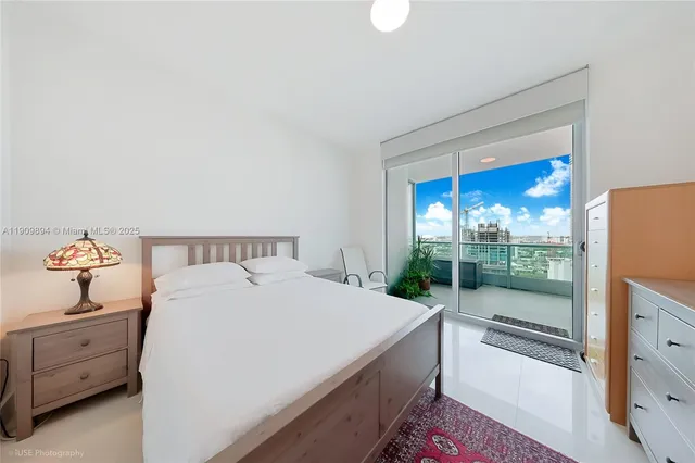 a bathroom with a toilet a sink a vanity and mirror