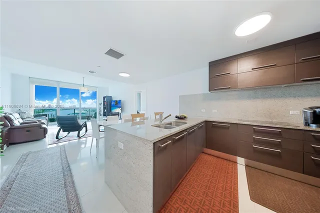 a bathroom with a double vanity sink mirror and toilet