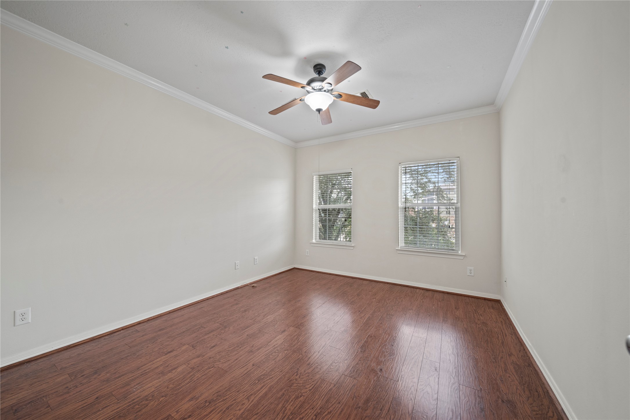 14443 Basalt Lane Houston, TX 77077 - Photo 18 of 39 a view of an empty room with wooden floor and a window