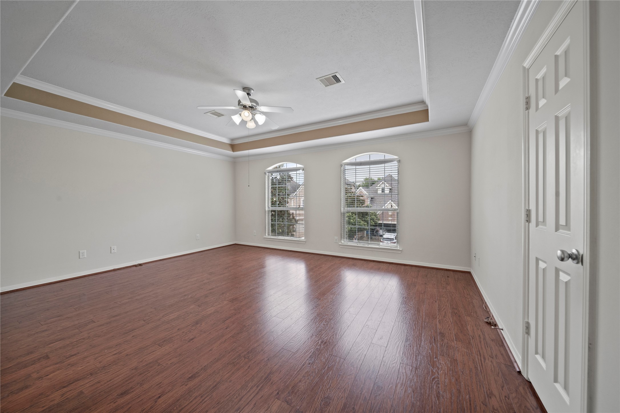 14443 Basalt Lane Houston, TX 77077 - Photo 19 of 39 a view of an empty room with wooden floor and a window