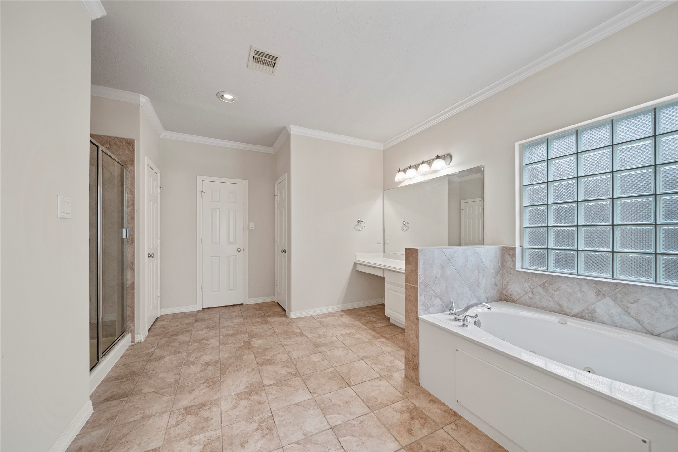 14443 Basalt Lane Houston, TX 77077 - Photo 22 of 39 a bathroom with a bathtub and a shower