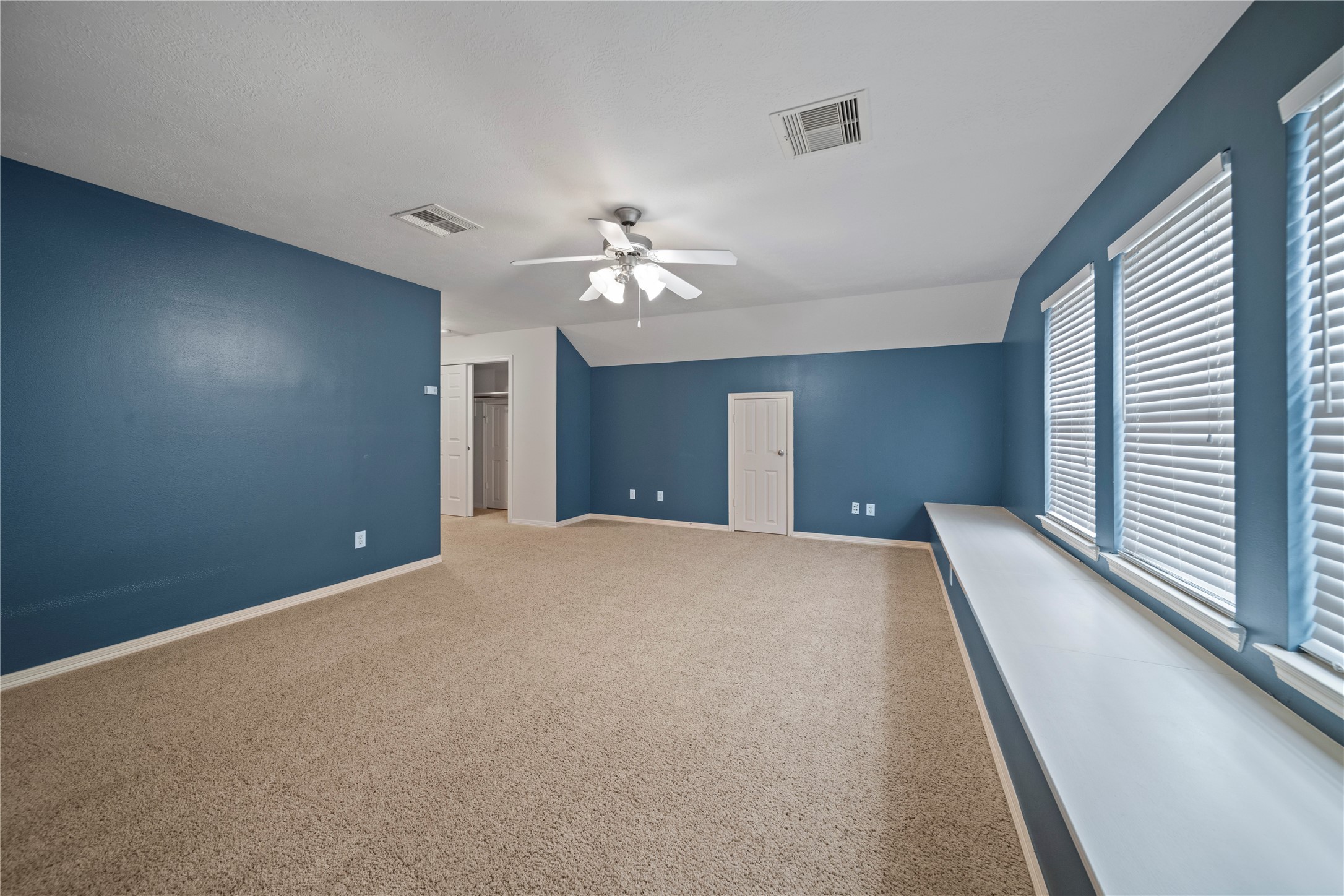 14443 Basalt Lane Houston, TX 77077 - Photo 34 of 39 a view of a big room with windows and chandelier fan