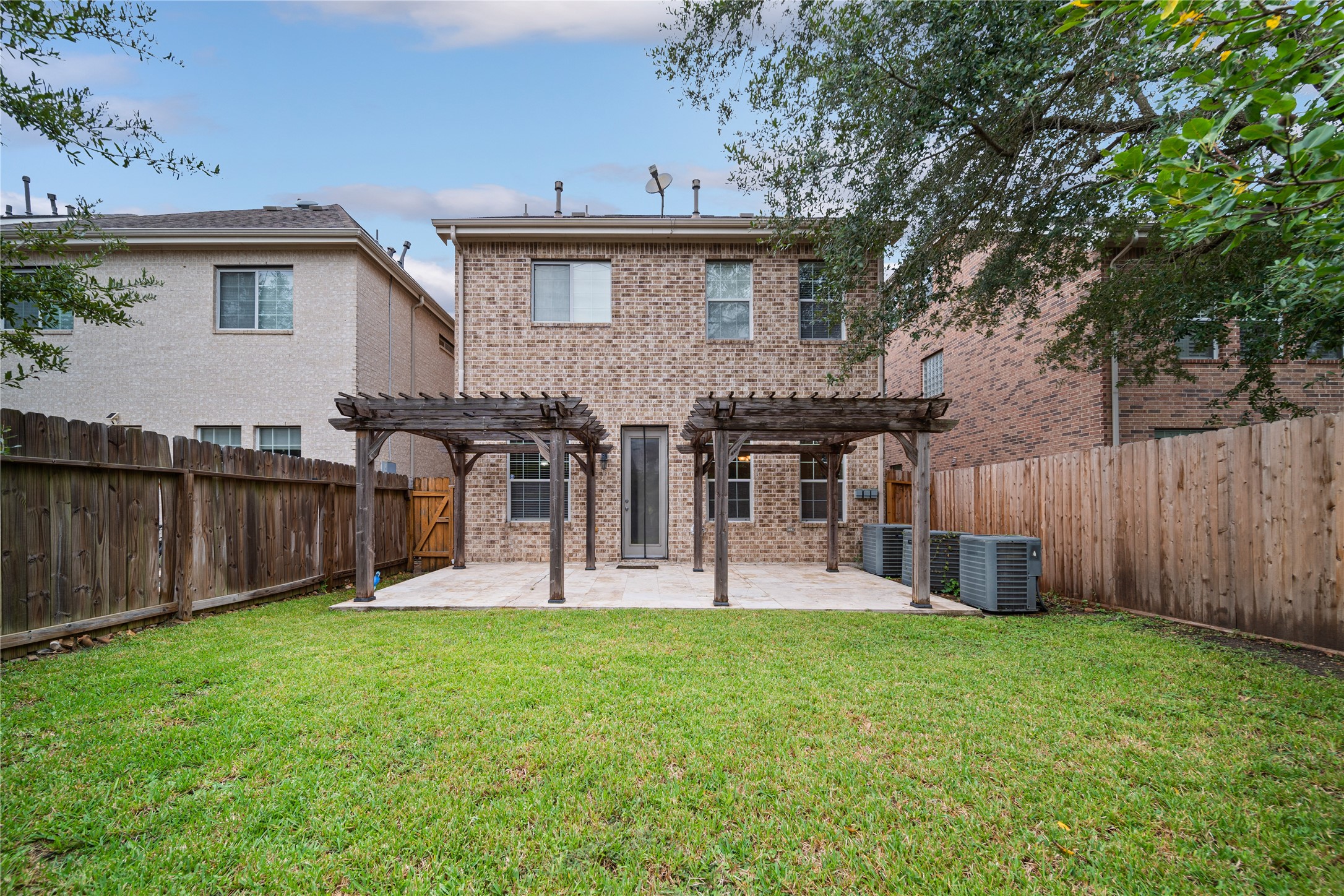 14443 Basalt Lane Houston, TX 77077 - Photo 37 of 39 a front view of a house with a yard and trees