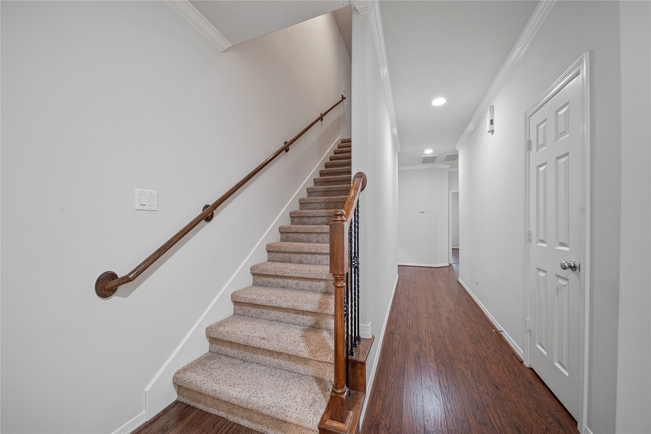14443 Basalt Lane Houston, TX 77077 - Photo 7 of 39 a view of a hallway with wooden floor and entryway
