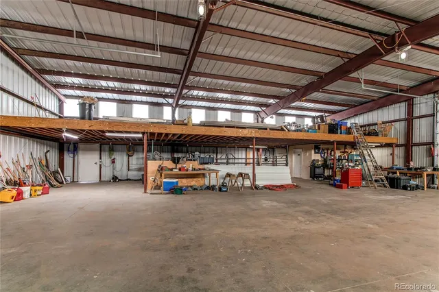 a view of a garage with parked cars